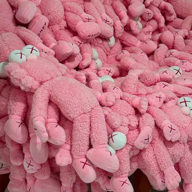 Pile of pink plush toys with X eyes