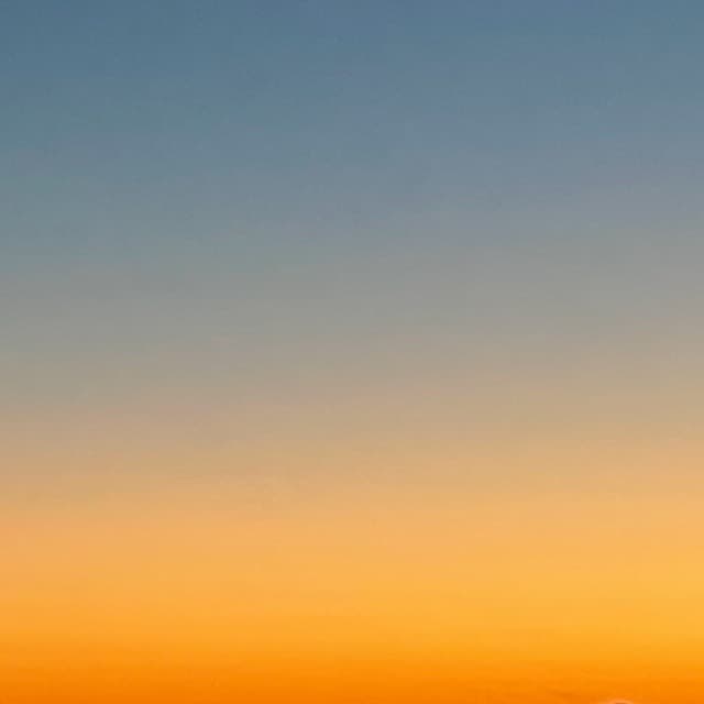 Half blue, half orange sunset gradient